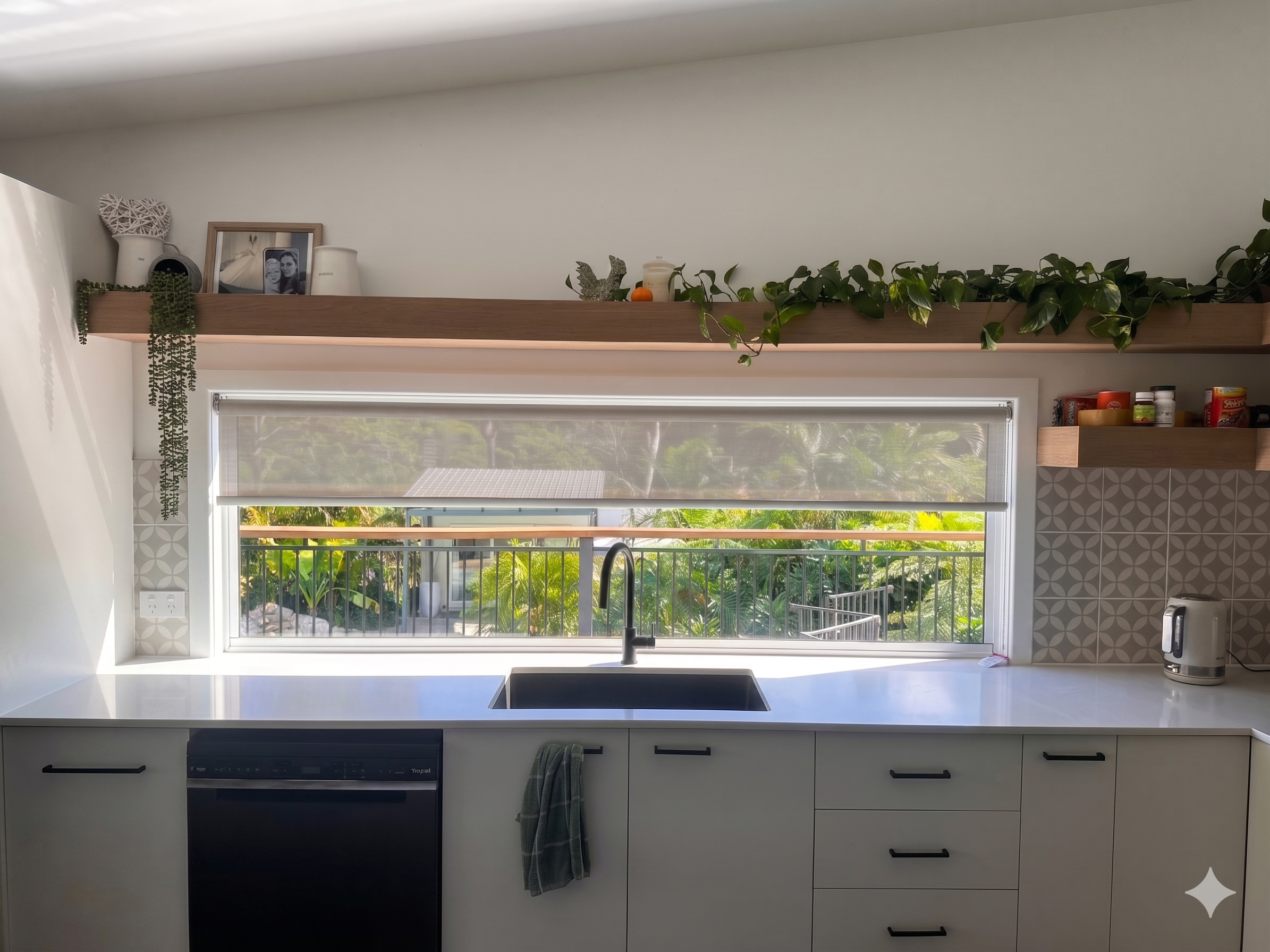 Blockout roller blind installed in a Gold Coast kitchen by Gold Coast Blinds and Shutters