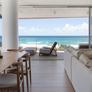 Floor-to-ceiling sheer curtains hung professionally by Gold Coast Blinds & Shutters