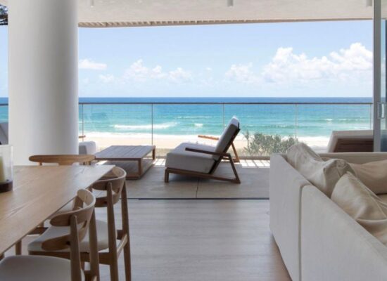Floor-to-ceiling sheer curtains hung professionally by Gold Coast Blinds & Shutters